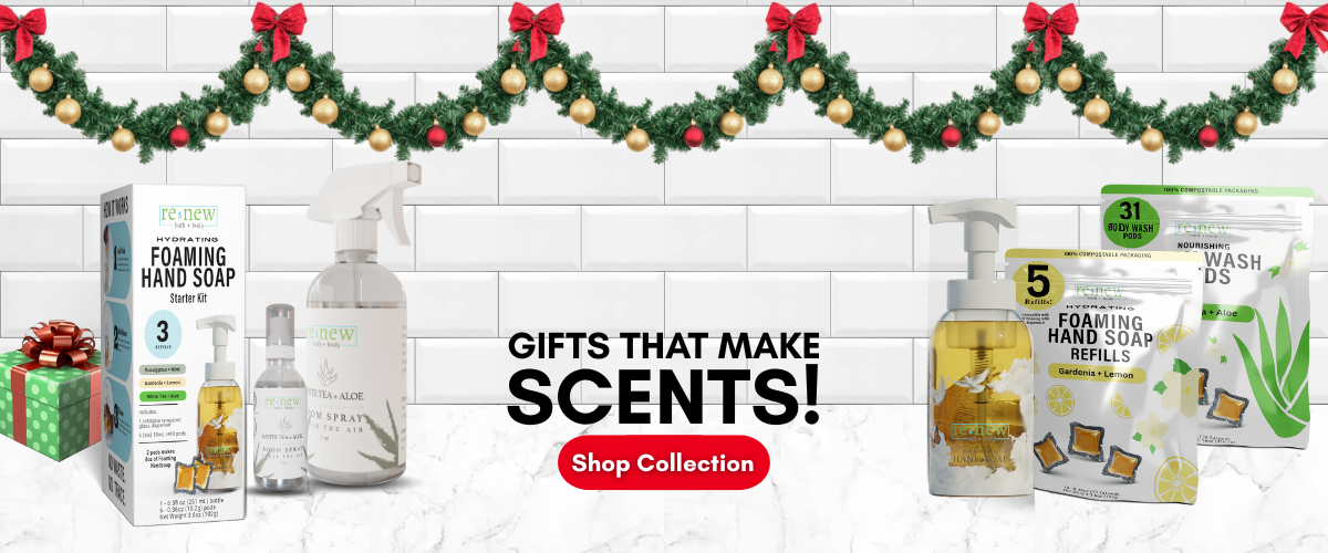 Hand soap products with Christmas decorations on a tiled wall background